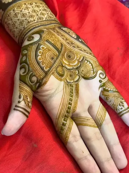 A close-up of a palm design with intricate swirls and floral elements.