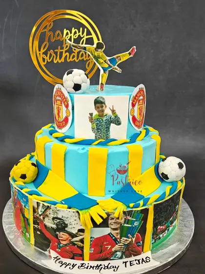 A grand three-tiered football cake for a Cristiano Ronaldo fan, decorated with edible photos and the Manchester United logo.