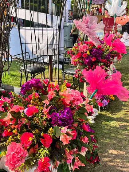 Lush, colorful floral arrangements are key to a fiesta theme. I used a mix of bright pink, purple, and orange flowers to create a vibrant and celebratory feel.