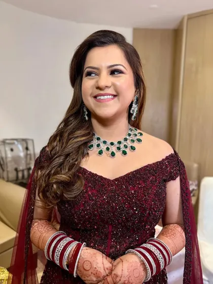 A smiling portrait of the bride, looking confident and glamorous.