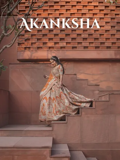 Grace and beauty personified. Our bride descending the steps at a beautiful heritage location, her lehenga flowing behind her.