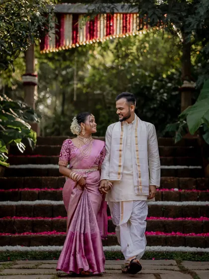 A playful and romantic moment on the steps of The Peacock Grove. We encourage our couples to be themselves, which allows us to capture their unique personalities and connection.