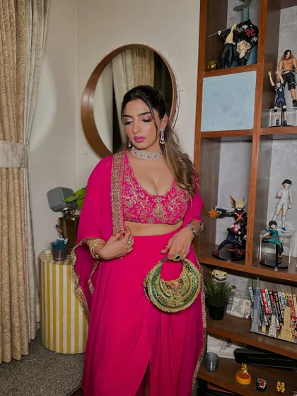 The full look, showcasing a gorgeous pink outfit and a confident pose. The makeup is glamorous and perfectly suited for a festive celebration.