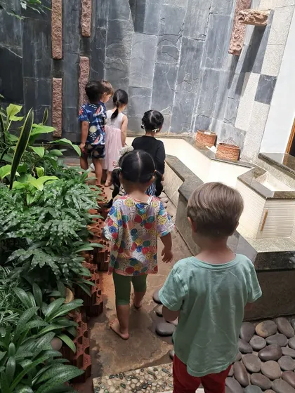 As part of exploring our community, we visited a neighbor's house to see their beautiful garden and koi pond.