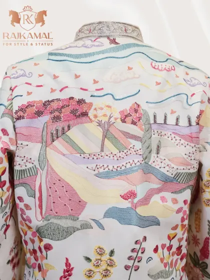 A detailed look at the back of the landscape-embroidered jacket, where the artistry of the threadwork and sequin detailing is on full display.