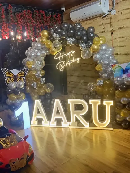 Another angle of Aaru's birthday decor, showing the toy car prop.