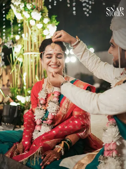 The groom lovingly places the mundavalya on the bride. We are experienced in capturing all the unique and meaningful rituals of a Maharashtrian wedding.
