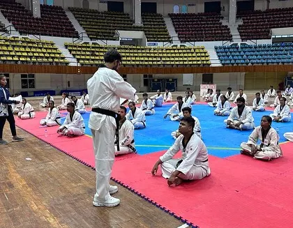 Another perspective of my role as an educator, instructing referees in a large stadium setting in Odisha.
