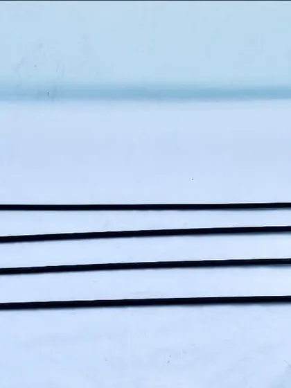 A set of heeling sticks ready for use. Their 31-inch length is ideal for providing a clear visual cue to the dog without being clumsy for the handler.