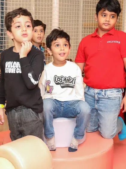 Kids watching the entertainment with looks of awe and excitement.