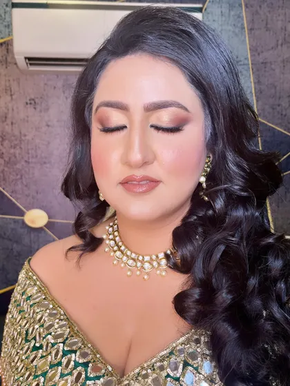 A close-up of the eye makeup for this cocktail look. The soft brown and gold tones are blended to perfection for a sultry effect.