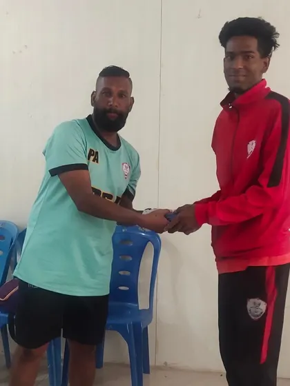 A player receiving his kit before the first game of the KSFA C Division league.