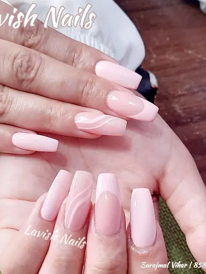 A clean and modern design with soft pink nails and accent nails featuring subtle white swirl line art.