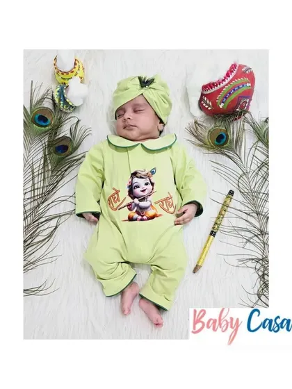 Another angle of the light green "Radhe Radhe" romper, showing how soft and sweet it looks on a sleeping baby.