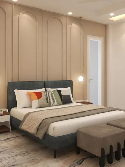 This guest bedroom in Lajpat Nagar features a beautiful beige and cream color palette, with elegant wall panels and contemporary pendant lights adding sophistication.