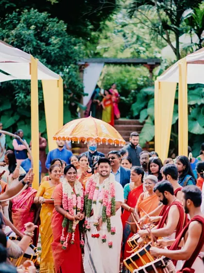 The joy of the wedding procession. The bride's radiant makeup shines through, a perfect complement to the happy celebration.
