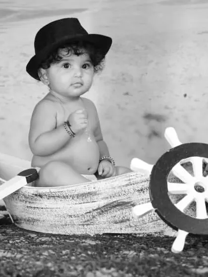 Explore our full nautical and beach-themed collection. These images showcase the variety of poses and angles possible with our boat prop, sand-colored flooring, and ocean backdrop.