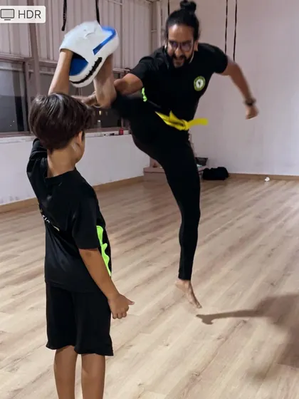 You can do more than you think. Our coach demonstrates a powerful jumping kick, inspiring students to challenge themselves every day.