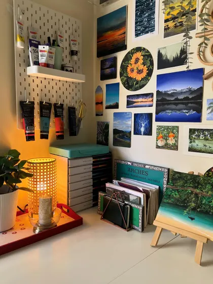 Another view of my art wall and desk, showing a new painting on an easel, ready to be worked on.