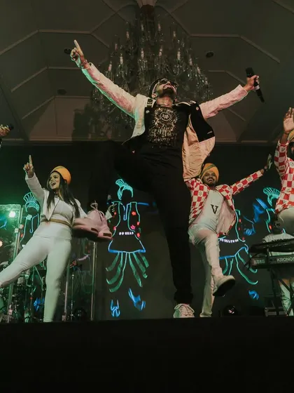 The full band on stage, bringing incredible energy to the Sangeet night. We believe live music is key to an unforgettable party.
