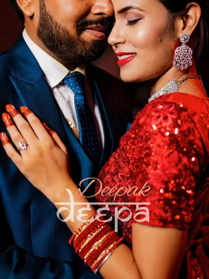 A close-up, romantic portrait of Deepak and Deepa. This shot beautifully captures the bride's stunning makeup and the couple's loving connection, with their names elegantly watermarked.
