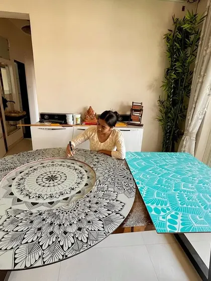 My happy place, surrounded by works in progress. Here I'm working on a black and white mandala next to a geometric teal piece.