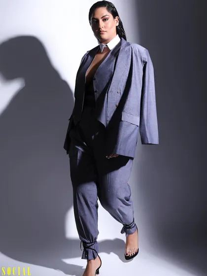 This full-length shot from the Sakshi Sindwani feature highlights the complete outfit, from the tailored suit to the strappy heels. It's all about creating a cohesive and impactful image.