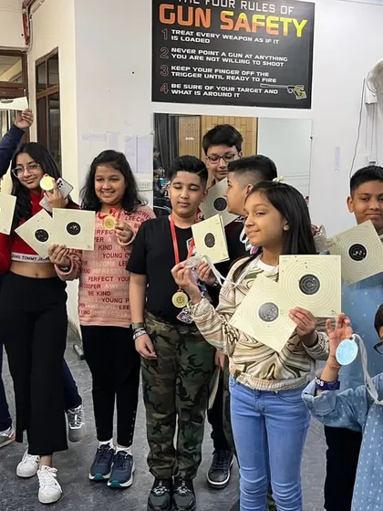 The smiles say it all. I love hosting events for kids, like this Children's Day celebration. Seeing them proudly show off their targets and medals after a safe and supervised shooting session is the best part of my job. It's a great option for a unique birthday party.