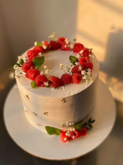 A simple and elegant Chocolate Truffle cake topped with a wreath of fresh raspberries. This 1.5kg cake was made for a Roka ceremony.