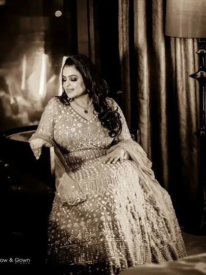An elegant, sepia-toned portrait of the bride-to-be on her engagement day. The classic pose and vintage edit create a timeless and sophisticated image.