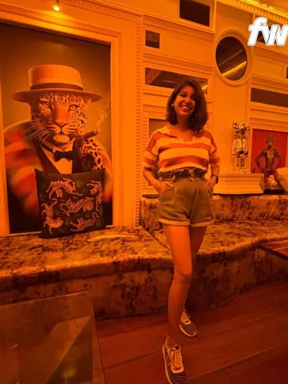A fun shot from my collaboration with Myntra FWD. I'm wearing a striped top with high-waisted shorts, a casual and trendy look.