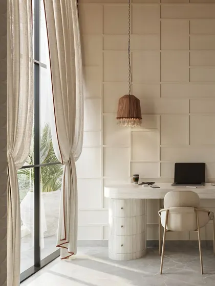 Natural light is a key element in a productive study area. Here, a minimalist desk is positioned by a large window with flowing linen curtains, creating a bright and airy environment perfect for learning and creativity.