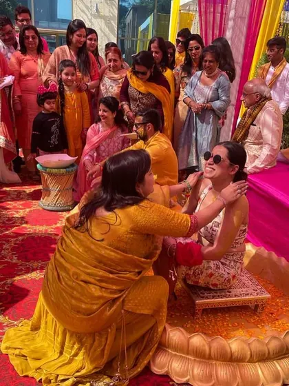 A candid moment from a fun-filled Haldi ceremony. I help style the entire event, ensuring the bride, groom, and family have coordinated and comfortable outfits.