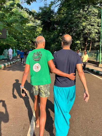 A moment of connection and support between two runners. The marathon is as much about community as it is about running.