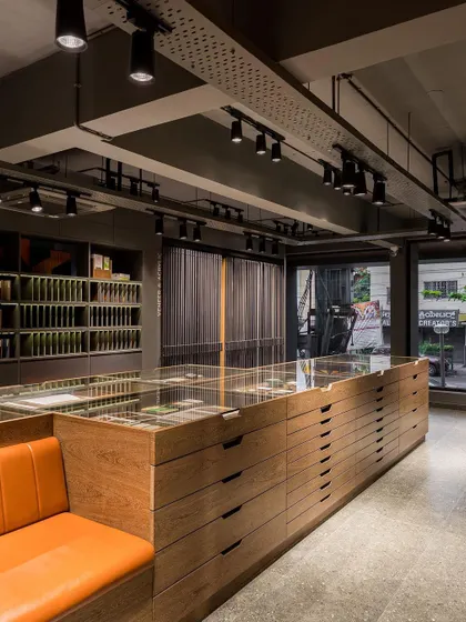 A static view of the central display island, showcasing its clean lines and the vast library of materials it holds.