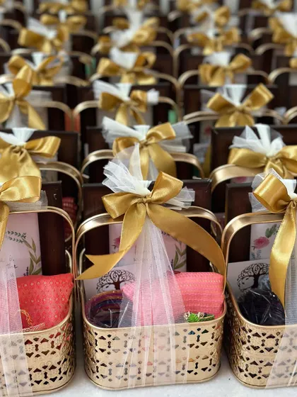 A closer view of the housewarming gift baskets, showing the personalized thank you card and the thoughtful contents.