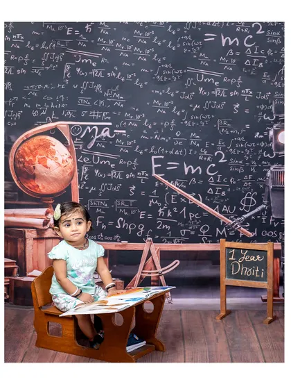 A one-year-old scholar named Dhriti. This photo shows how we can personalize our setups to celebrate your child's specific milestones.