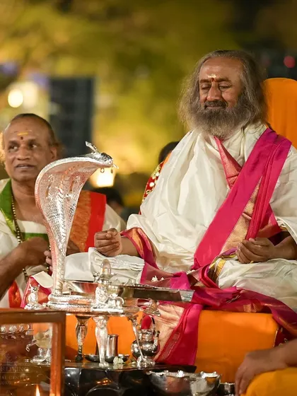 We celebrate ancient traditions with reverence and joy. This is a moment from our Maha Shivratri celebration, where I am absorbed in the chants and rituals that honor the Shiva principle, the quiet, blissful consciousness within us all.