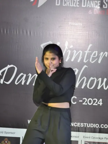 Solo performer Pooja striking a pose during the Winter Dance Showcase 2024.