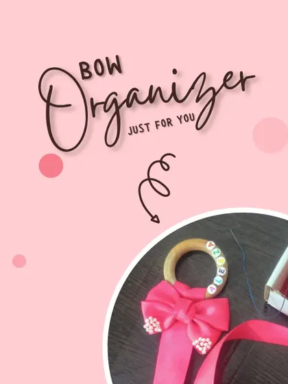 To keep all your stylish hair accessories organized, we created this handmade bow holder with a wooden ring and long pink ribbon.