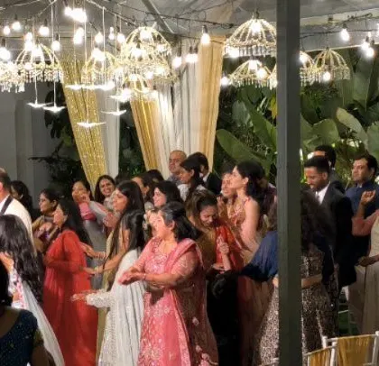 Guests dancing and celebrating the happy couple.