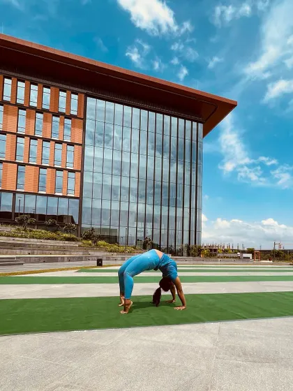Movement is my medicine. Here I am doing a wheel pose (Chakrasana) outdoors. I incorporate elements of yoga and mobility to keep my body balanced and healthy.