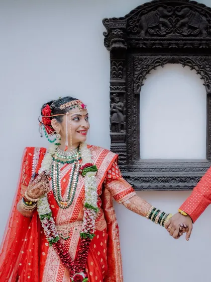 A lovely "follow me to" style shot, where the bride leads the groom, her smile full of happiness and excitement for their future.