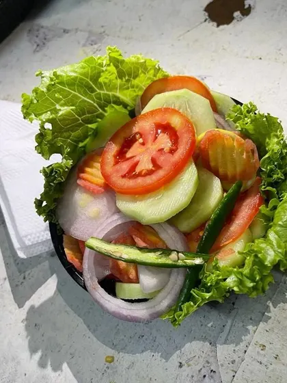 A closer look at our simple and refreshing side salad. It's the perfect, crisp accompaniment to any of our thalis or rice meals.
