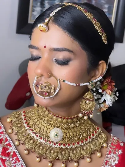 A portrait of pure royalty. For Anushree's wedding, I created a dramatic smokey eye and paired it with a flawless base to complement her stunning antique gold jewelry and traditional red saree.