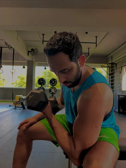 A seated dumbbell curl allows for strict form to isolate the bicep muscle. We focus on controlled movements rather than just swinging the weight around.