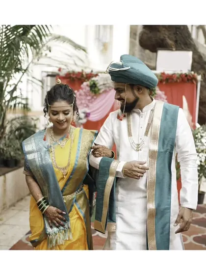 A candid walking shot, capturing the couple's natural interaction and happiness.
