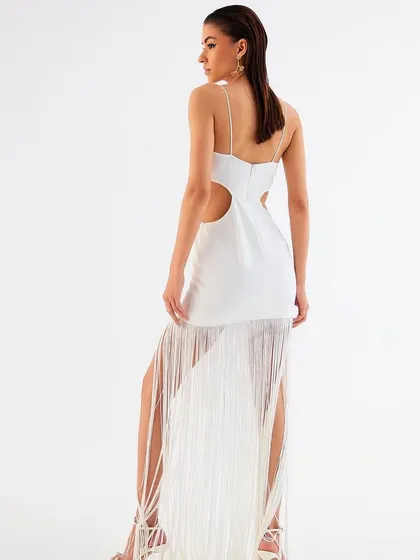 The back view of the white fringe dress by Tisharth by Shivani, highlighting the cutout details.