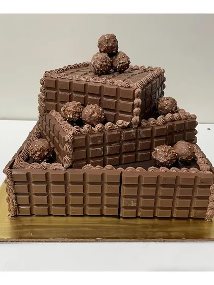 A different view of the impressive three-tier chocolate overload cake.