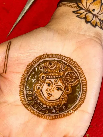 A close-up of a Shrinathji portrait, a form of devotional art that requires immense precision and care. I use only herbal henna to ensure the details are sharp and the final stain is deep and rich.